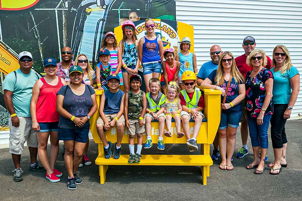 Diggerland USA - Homepage 4 opt group posing at diggerland big chair smiling landscape